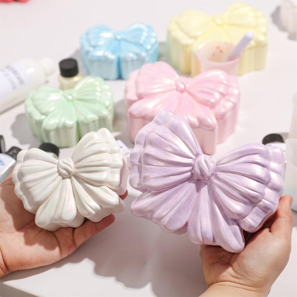 Two bow storage jars in different sizes with glitter sealer varnish finish - Boowan Nicole