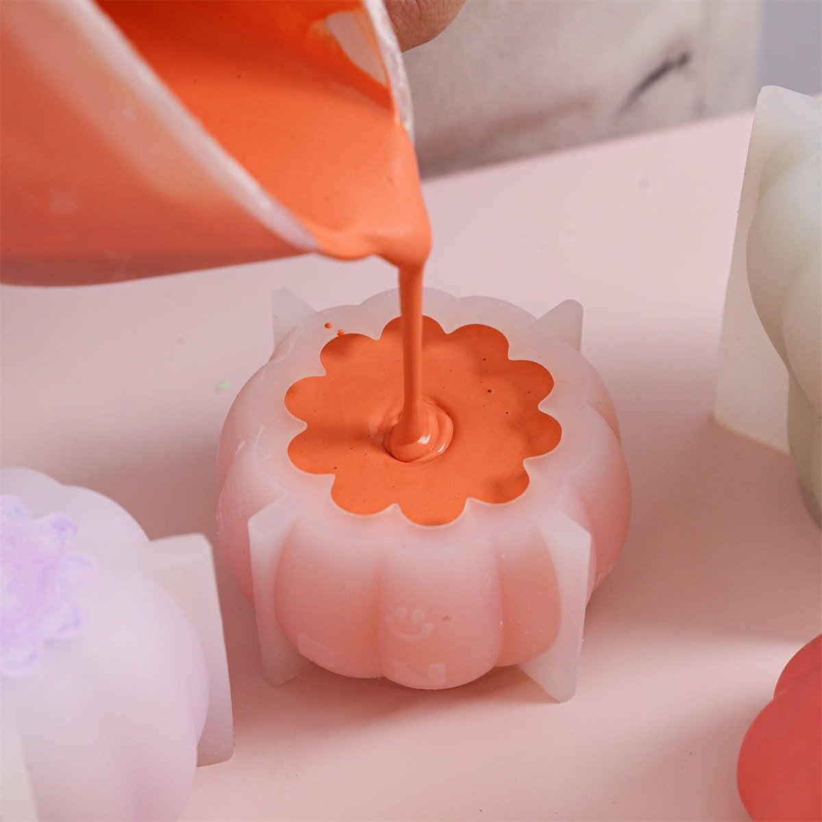 Pour the prepared pumpkin-colored Boowannite mixture into the silicone mold - Boowan Nicole