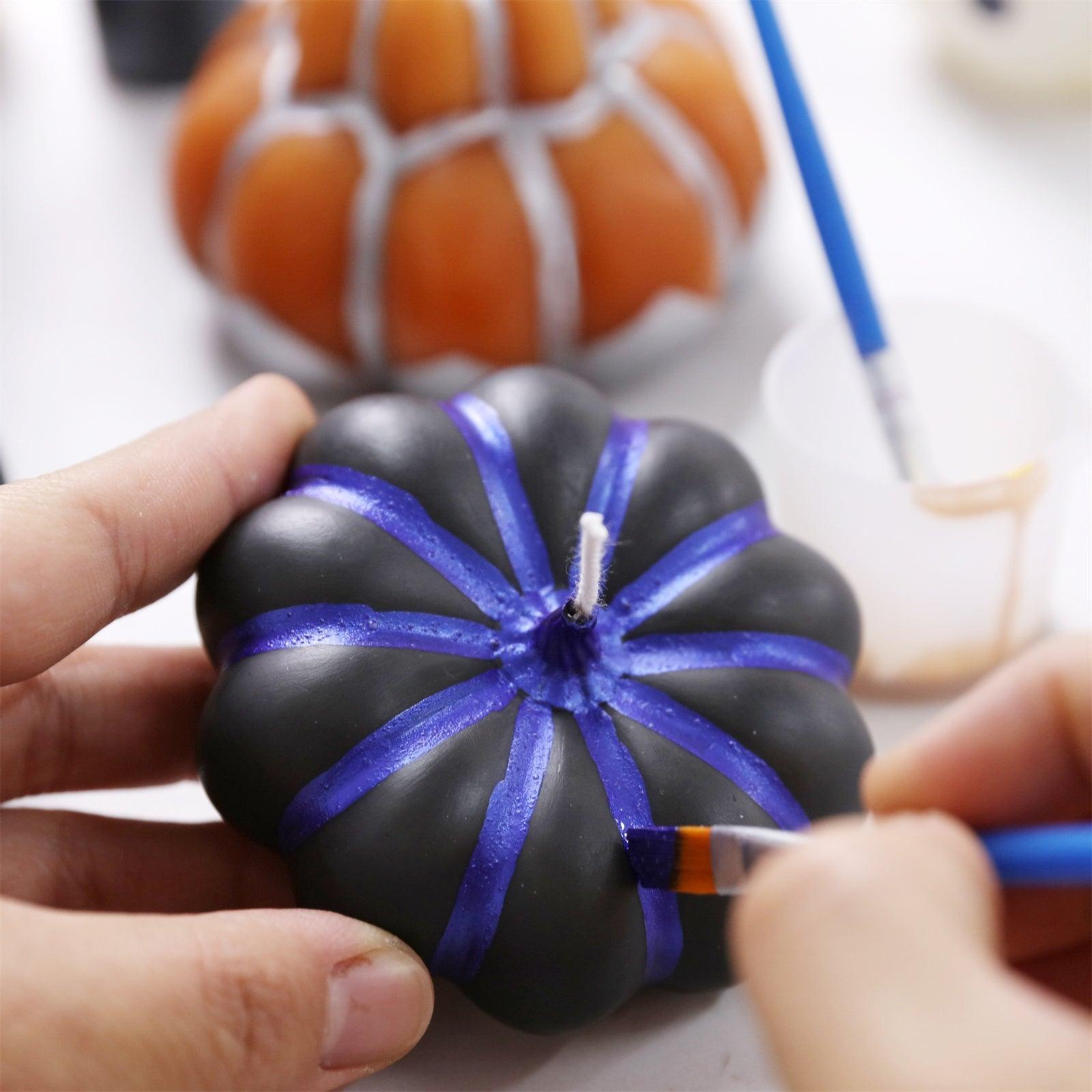 Hand-paint the black pumpkin candle with purple Halloween-themed glossy varnish to enhance the festive atmosphere.