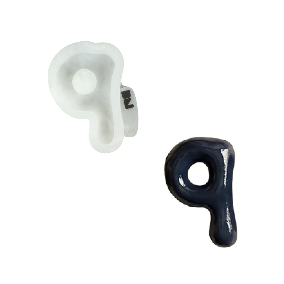 Lowercase letter q silicone mold and the matching finished soap on a white background
