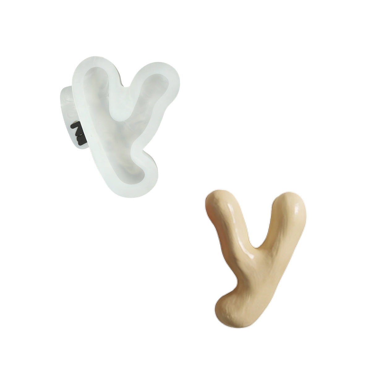 Lowercase letter y silicone mold and the matching finished soap on a white background
