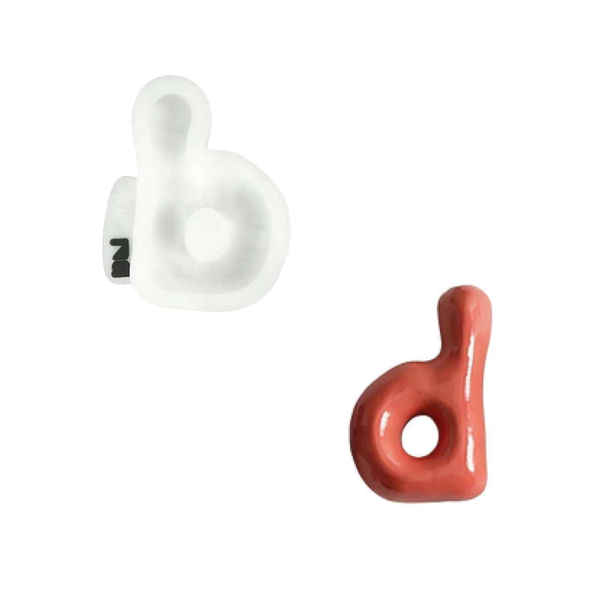 Lowercase letter d silicone mold and the matching finished soap on a white background