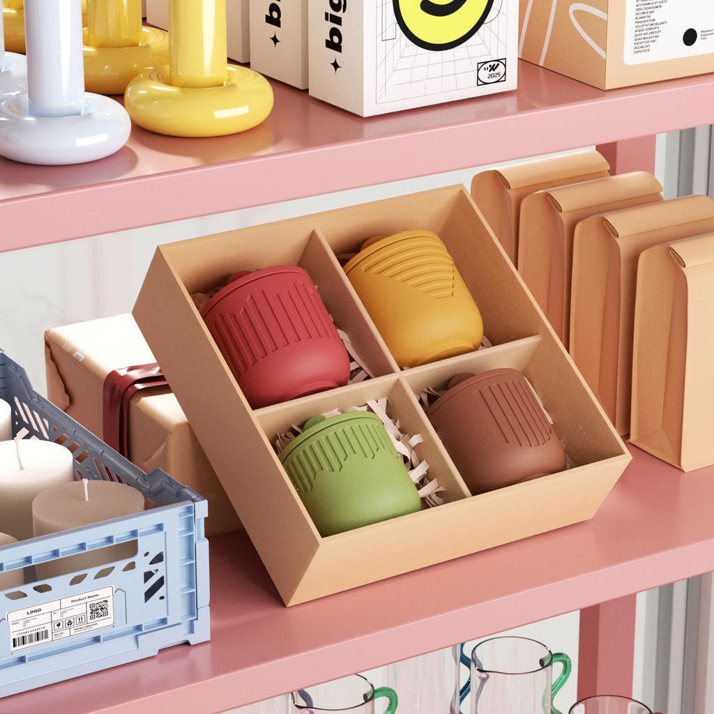 Set of four ribbed candle jars in red, yellow, green, and brown, neatly packed in a kraft gift box on a pink shelf - Boowan Nicole