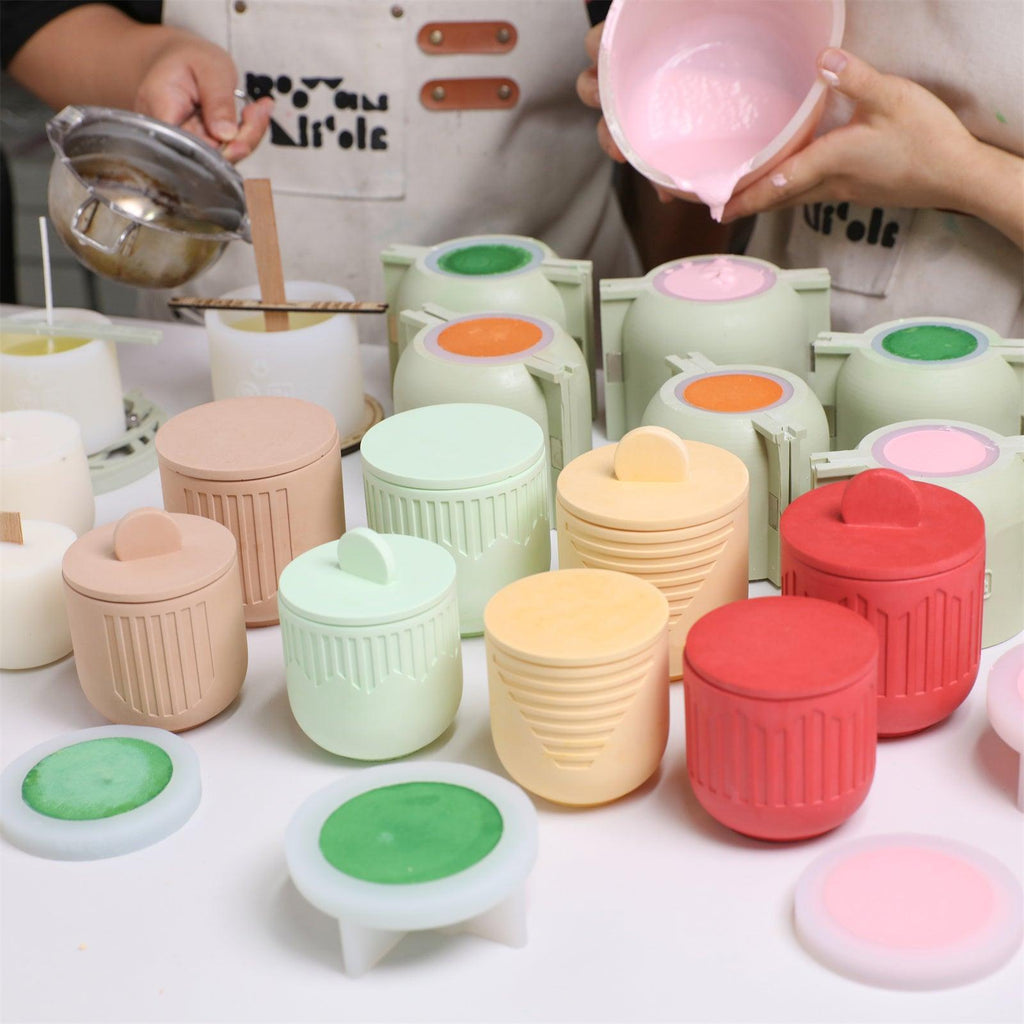 Pouring mixed concrete into a candle jar silicone mold with a reinforced support shell - Boowan Nicole