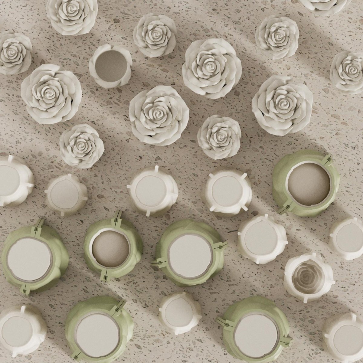 Batch production of rose-shaped candle jars and molds arranged neatly on a terrazzo surface - Boowan Nicole