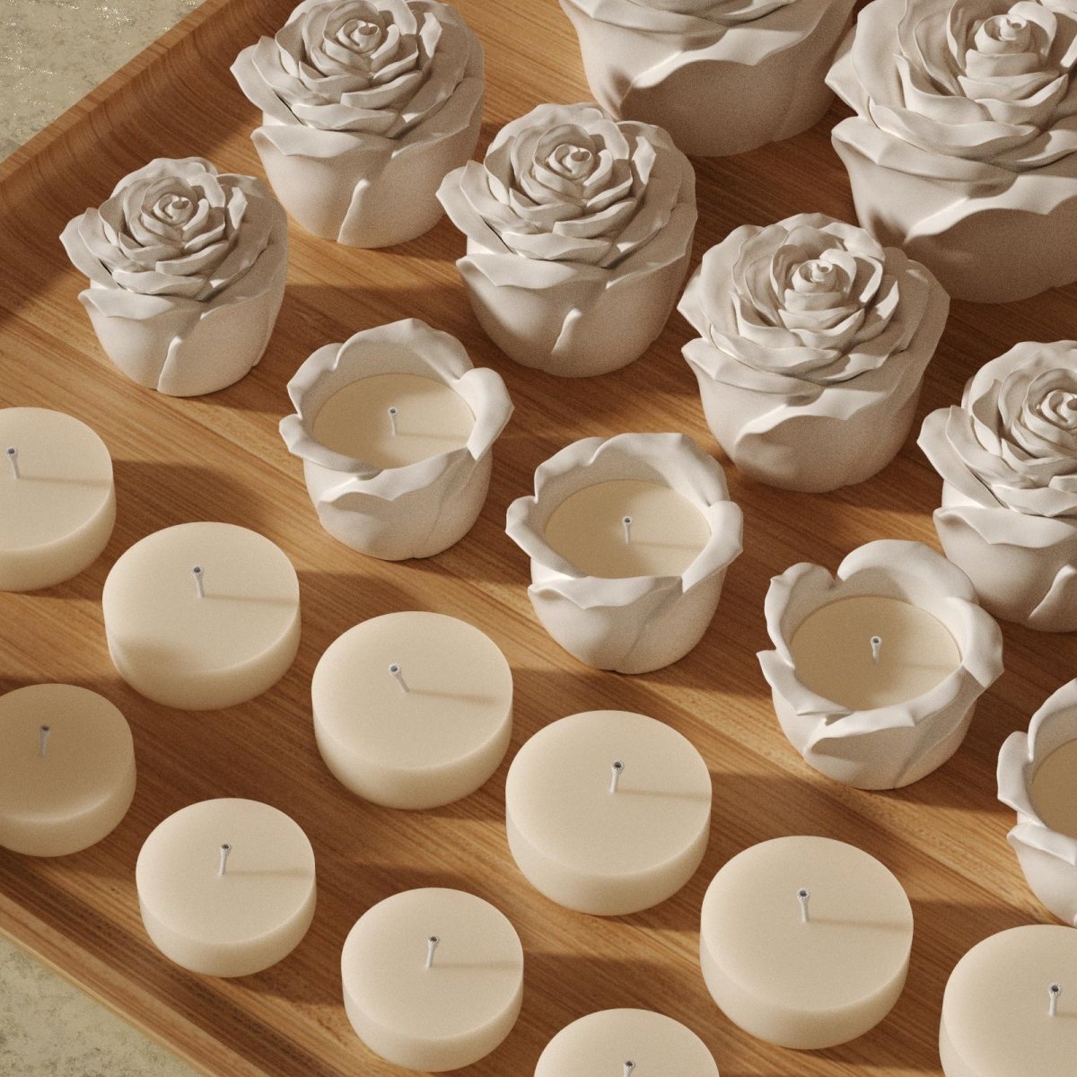 Batch-made rose-shaped candle jars and matching refill candles neatly displayed on a wooden tray - Boowan Nicole