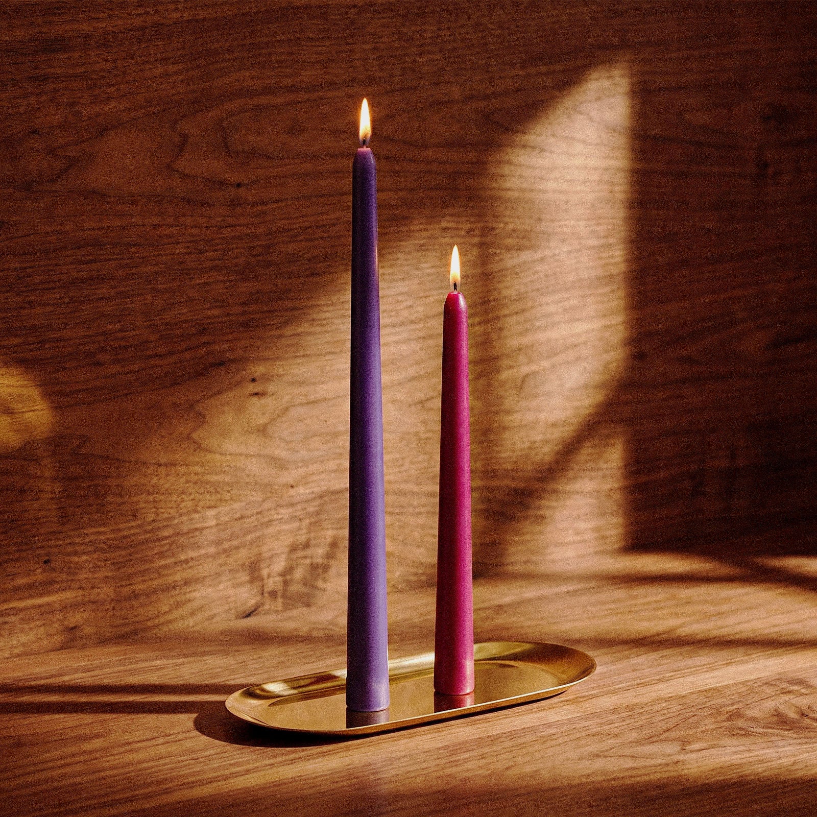 Round Top Taper Acrylic Candle Mold Collection, lit taper candles on gold tray in warm wooden home setting - Boowan Nicole