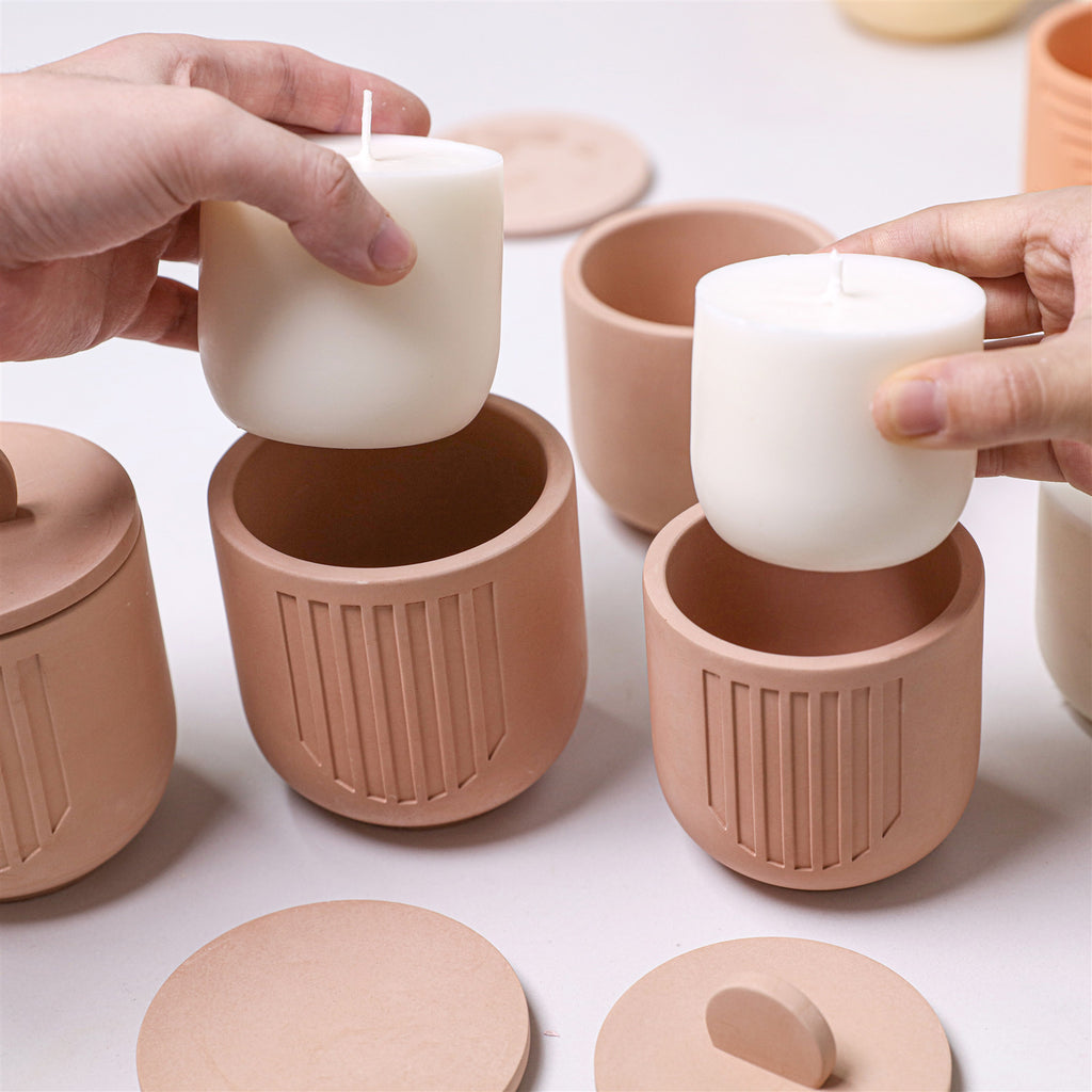 Placing a candle refill insert into a concrete geometric candle jar - Boowan Nicole