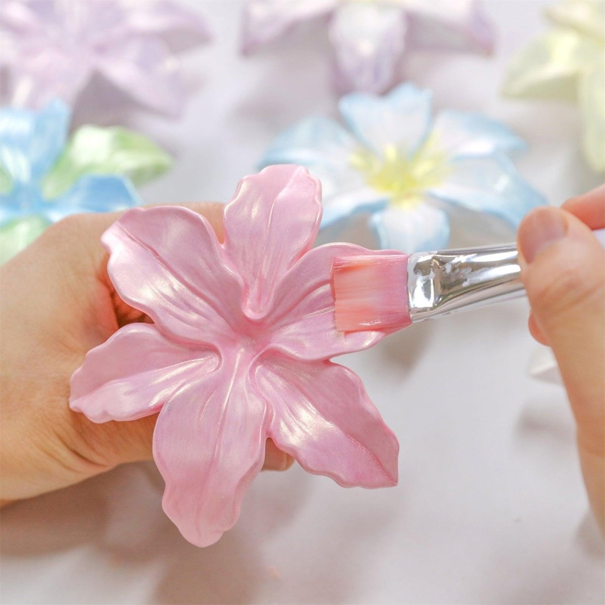 Pink mica powder varnish applied to hand-poured blooming lily petals - Boowan Nicole