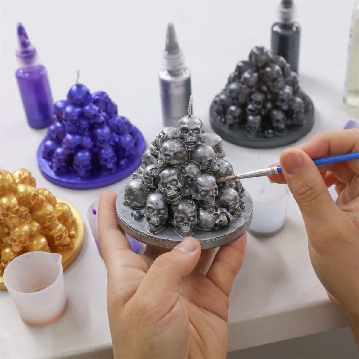 Hand-painted the Skull Mountain candle with silver glossy candle varnish for a striking metallic finish - Boowan Nicole