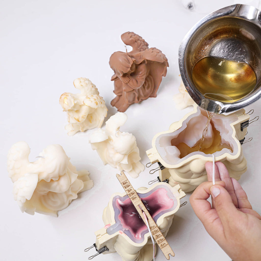 Pouring the prepared wax into the angel candle silicone mold with a support shell - Boowan Nicole