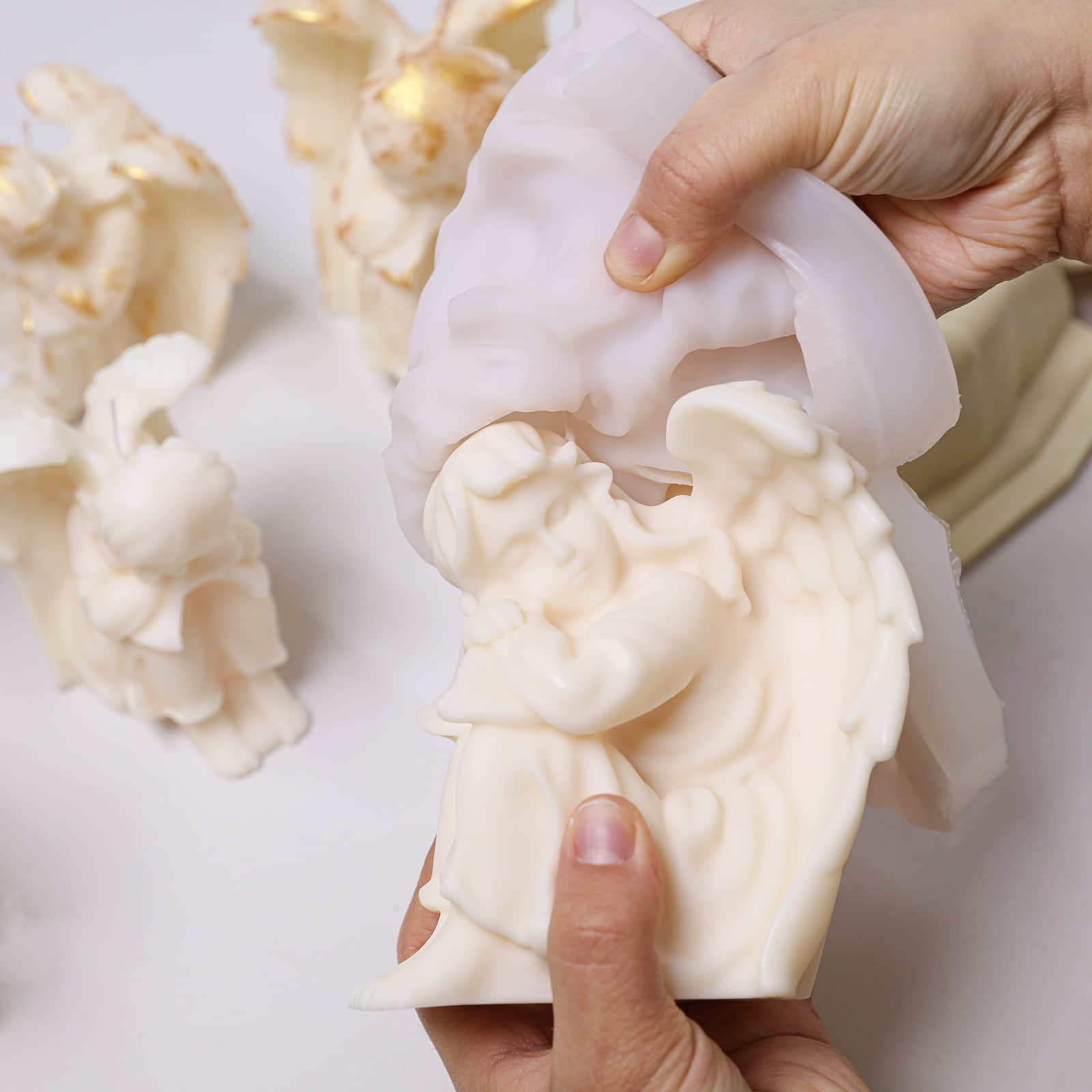 Demolding a white Sleeping Angel candle from the silicone mold - Boowan Nicole