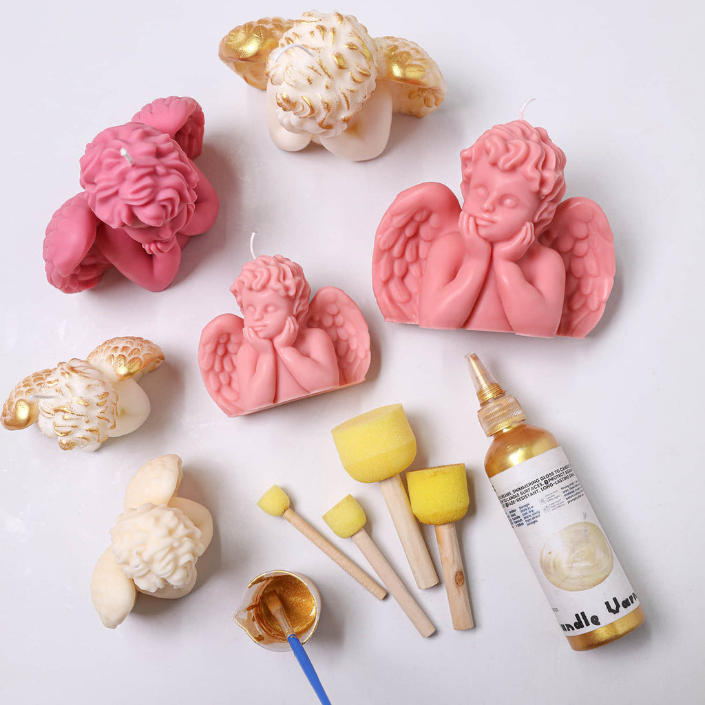 Sleeping Angel cherub candles in pink and ivory with wings—gold accents, sponge brushes, and bottle of gold candle varnish for DIY painting - Boowan Nicole