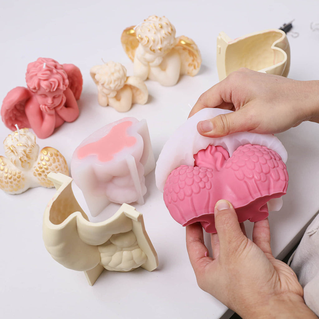 Demolding the pink Sleeping Angel cherub candle from a silicone mold with a support shell - Boowan Nicole