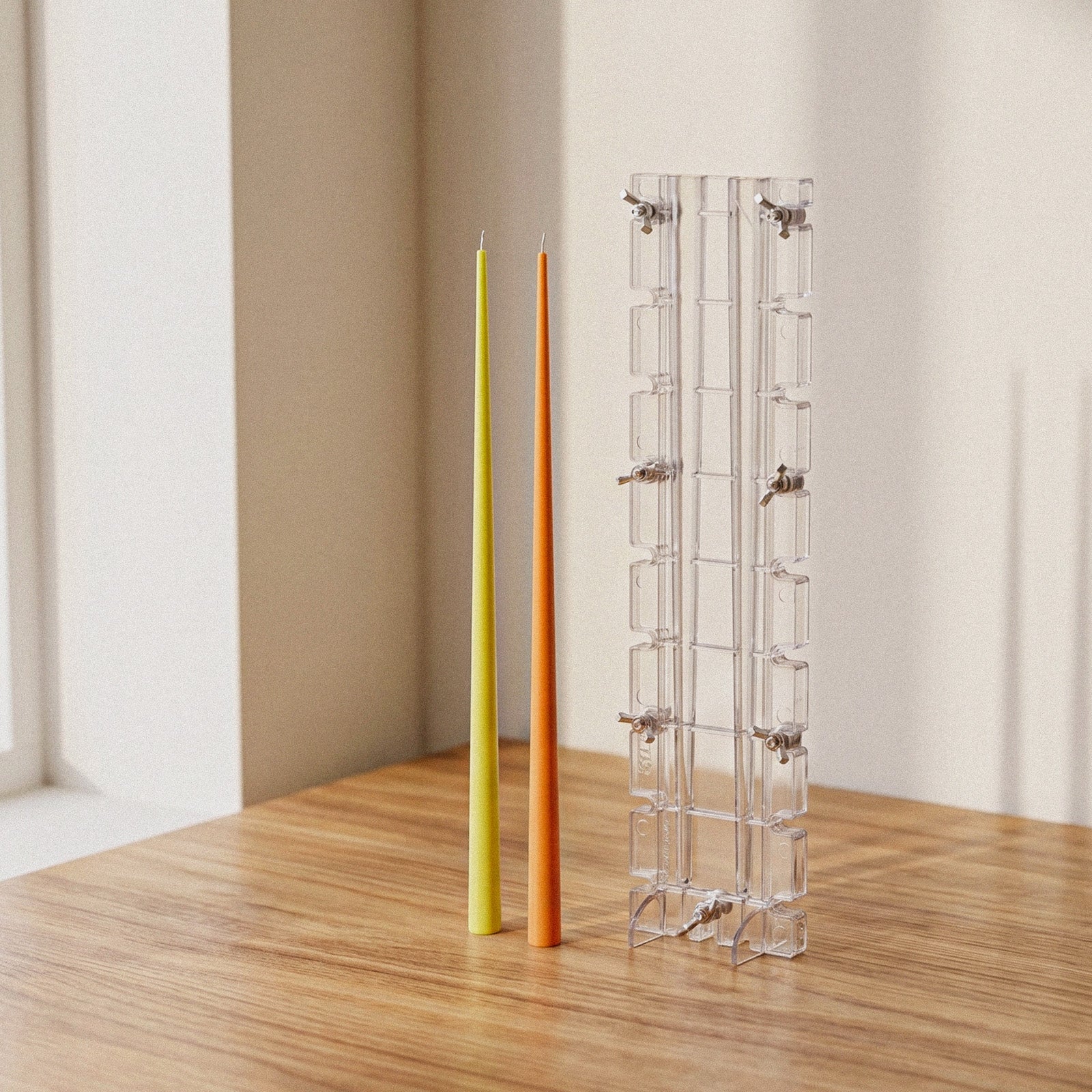 Ultra Slim Taper Acrylic Candle Mold, clear mold next to finished slim taper candles on wooden table - Boowan Nicole