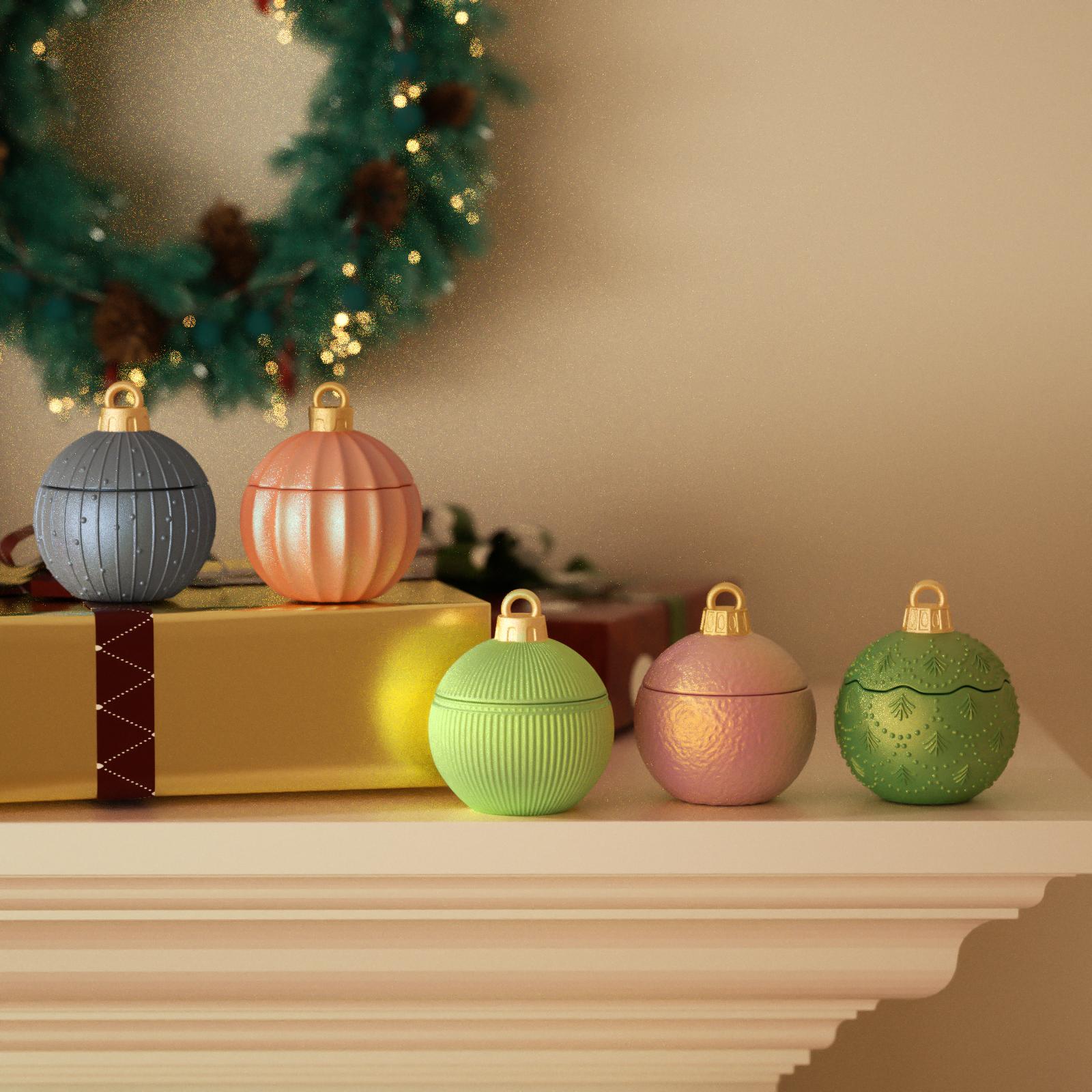 Colorful Christmas bauble candle jars on a mantel with wreath and gift box - Boowan Nicole