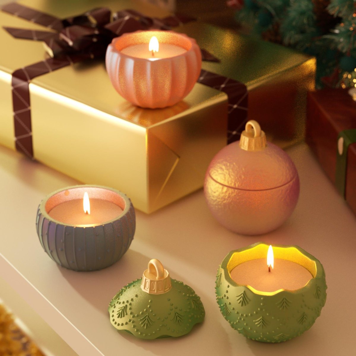 Lit Christmas bauble candle jars in festive colors displayed beside golden gift boxes and holiday décor - Boowan Nicole