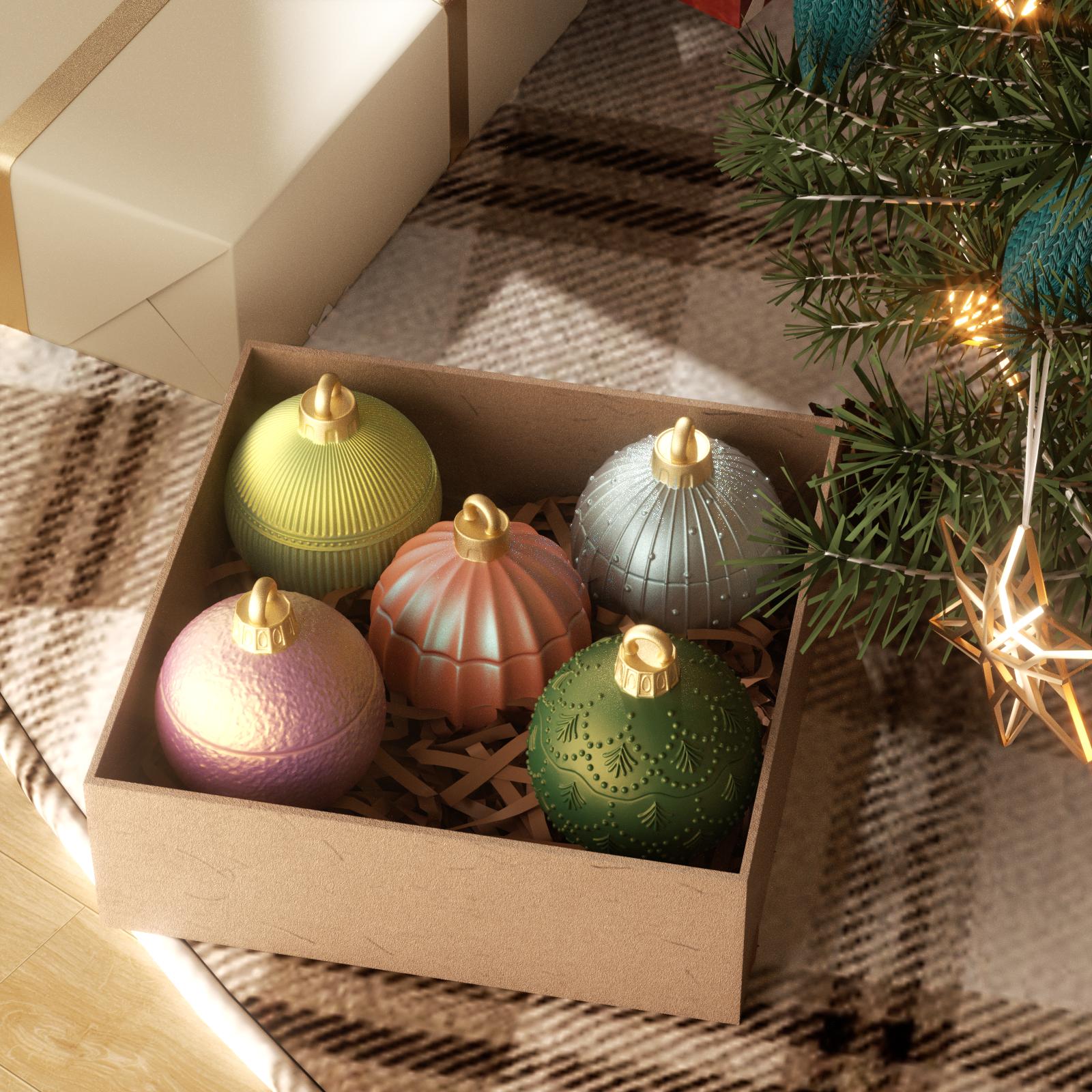 Gift box with five colorful Christmas bauble candle jars under a decorated tree - Boowan Nicole
