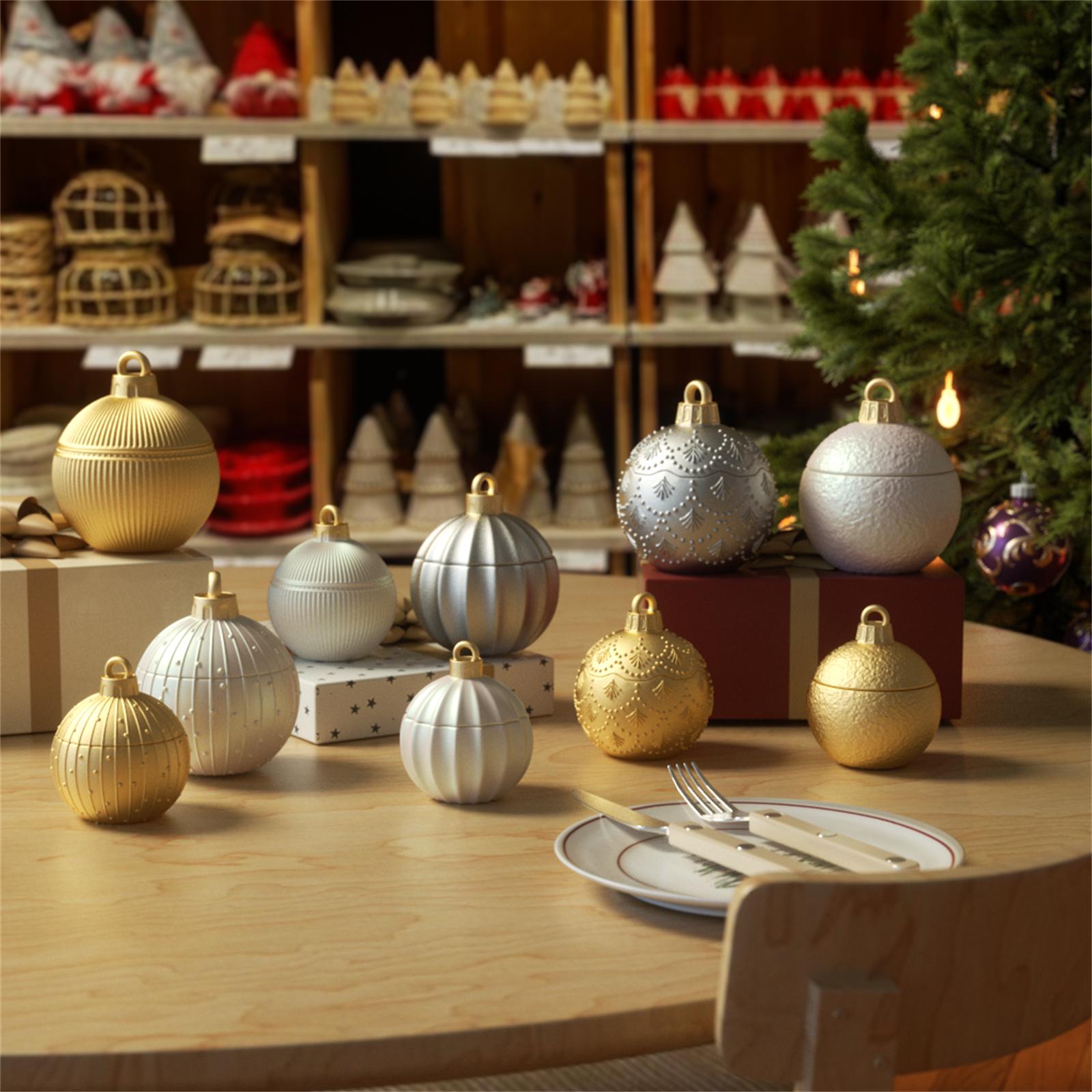 Gold and silver Christmas bauble candle jars displayed on holiday table with festive background - Boowan Nicole