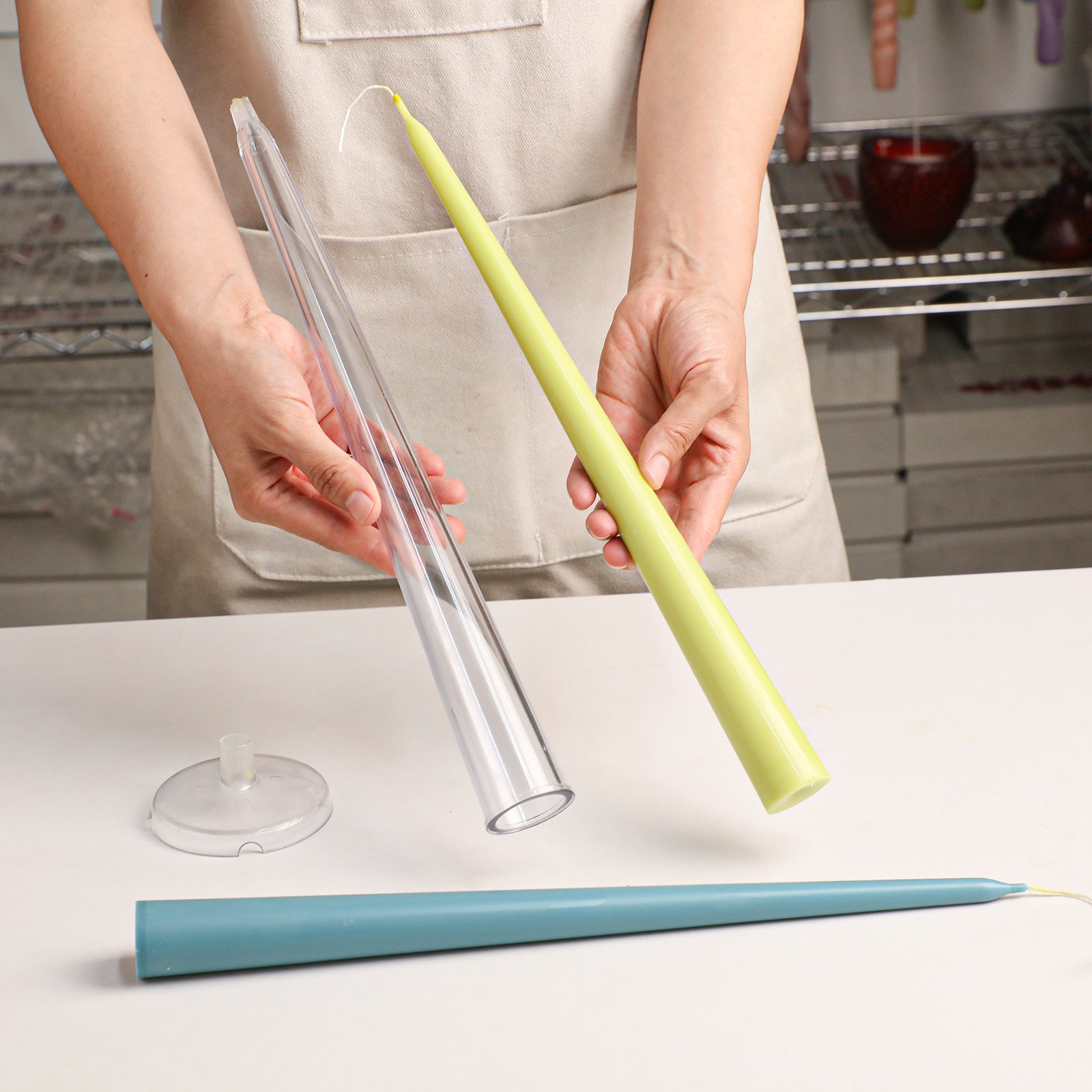 Smooth Taper Acrylic Candle Mold, unmolding finished green taper candle from clear acrylic mold - Boowan Nicole