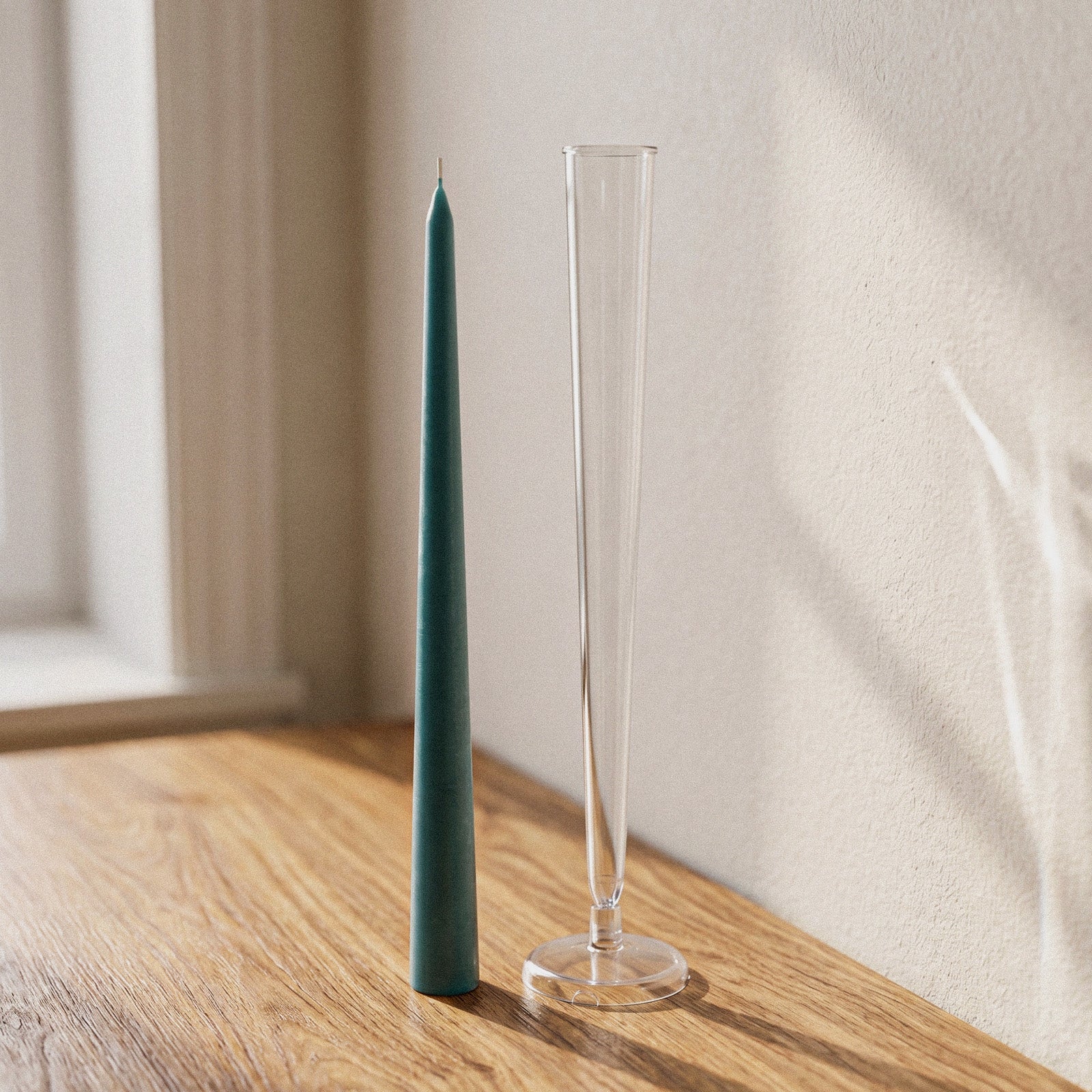 Smooth Taper Acrylic Candle Mold, clear mold next to finished green taper candle on wooden table - Boowan Nicole