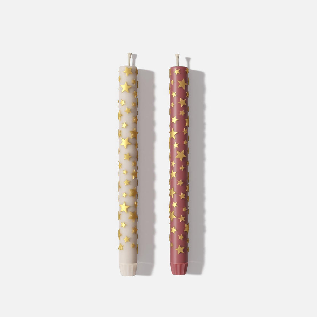 Two tall taper candles with raised golden star patterns, one in white and one in red - Boowan Nicole