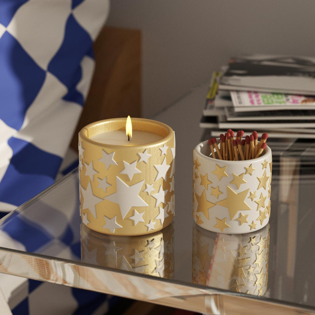 Handmade golden star candle jars, with a small jar for matches and a large jar for candles, on a glass bedside table-Boowan Nicole