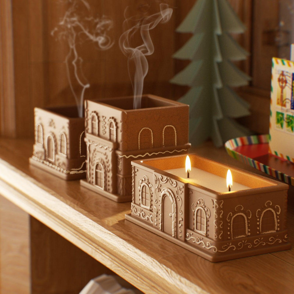 Lit and extinguished gingerbread house candles on a wooden shelf in a cozy Christmas setting - Boowan Nicole
