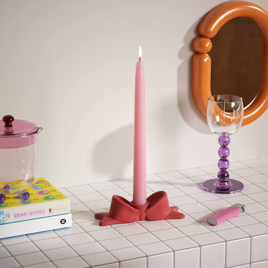 Pink bow candle holder paired with tapered candles adds color to the home decor-Boowan Nicole