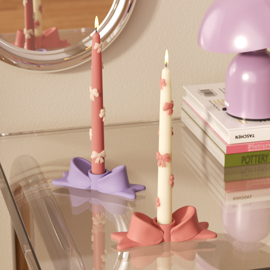 Charming bow-shaped candle holders in pastel pink and purple, paired with elegant floral tapered candles, perfect for adding a delicate touch to any room-Boowan Nicole