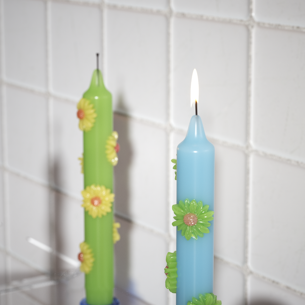 Handcrafted daisy-adorned candles in vibrant colors, perfect for adding a unique floral charm to any space-Boowan Nicole