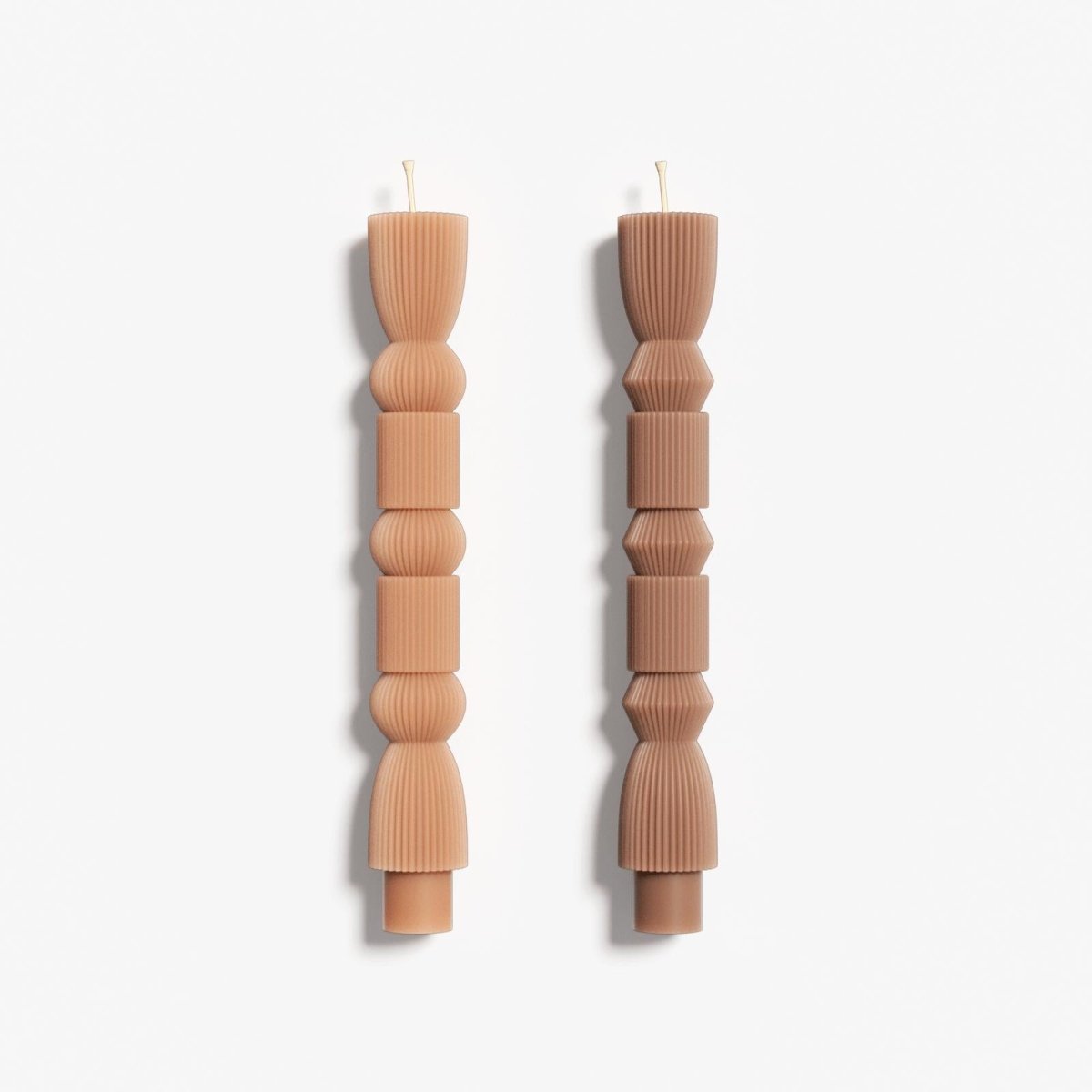Two different designs of geometric taper candles