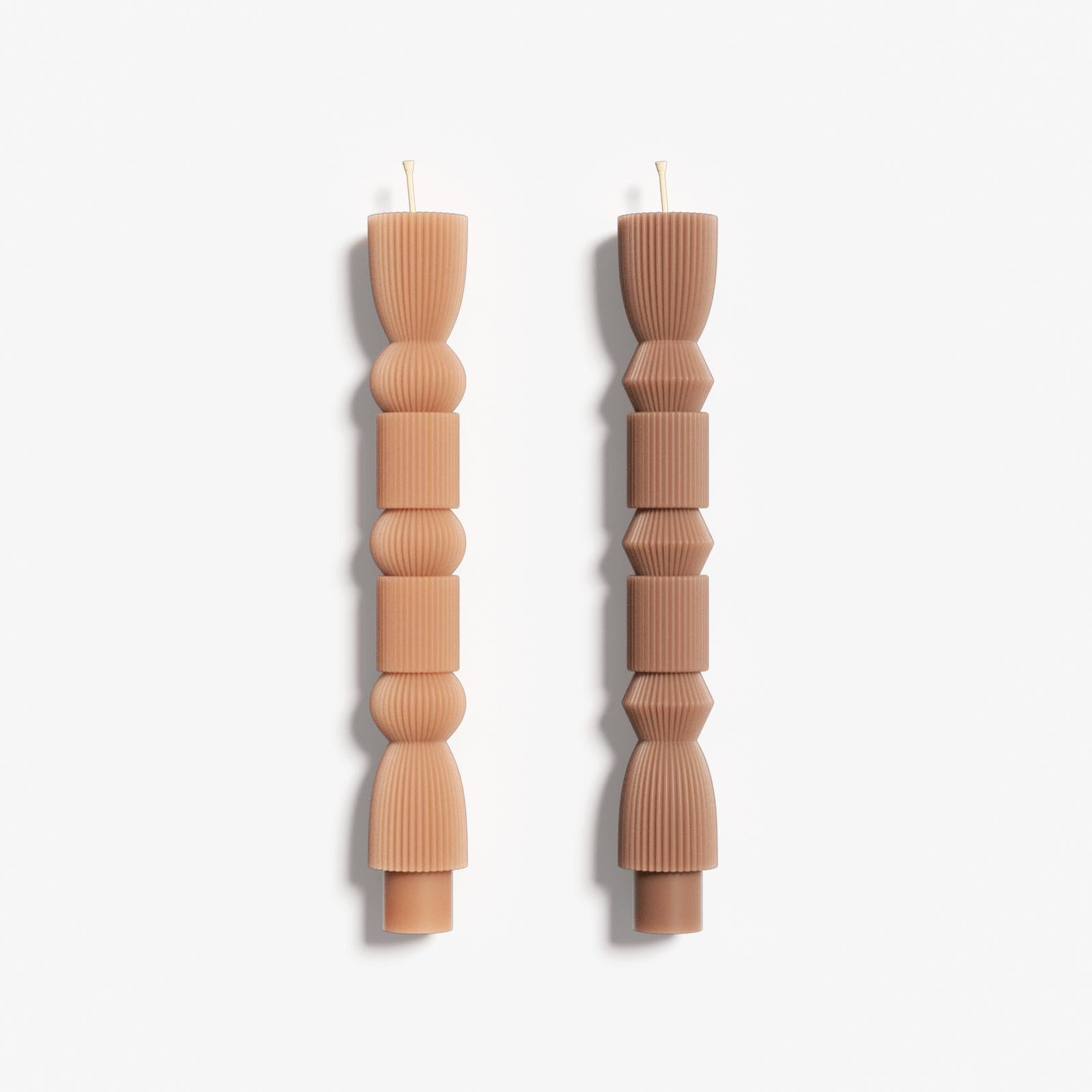Two different designs of geometric taper candles