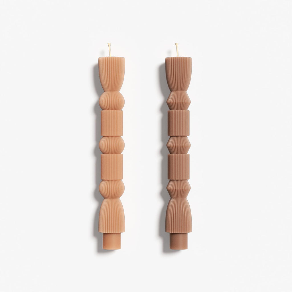 Two different designs of geometric taper candles