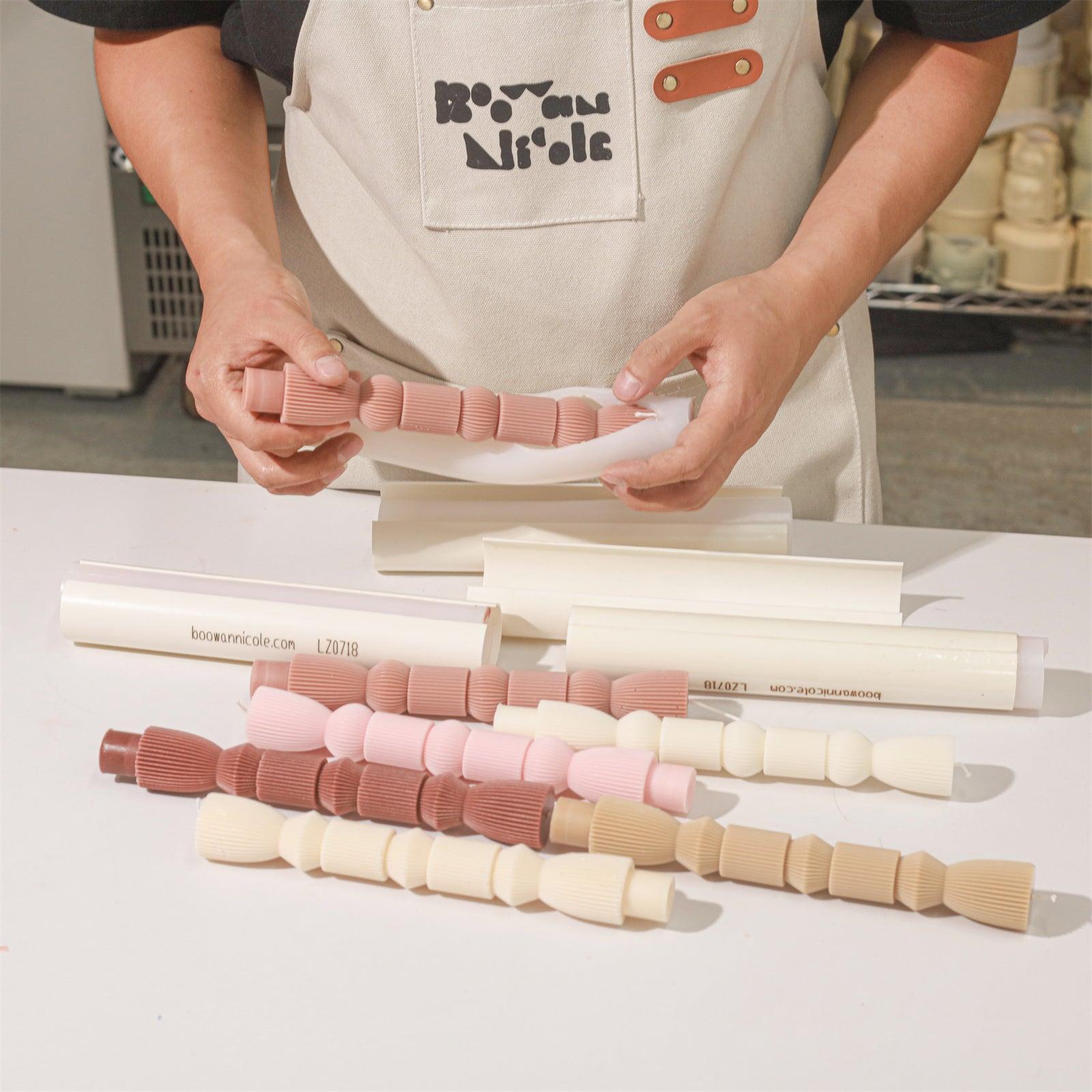 Demolding pink geometric pillar candles -- Boowan Nicole