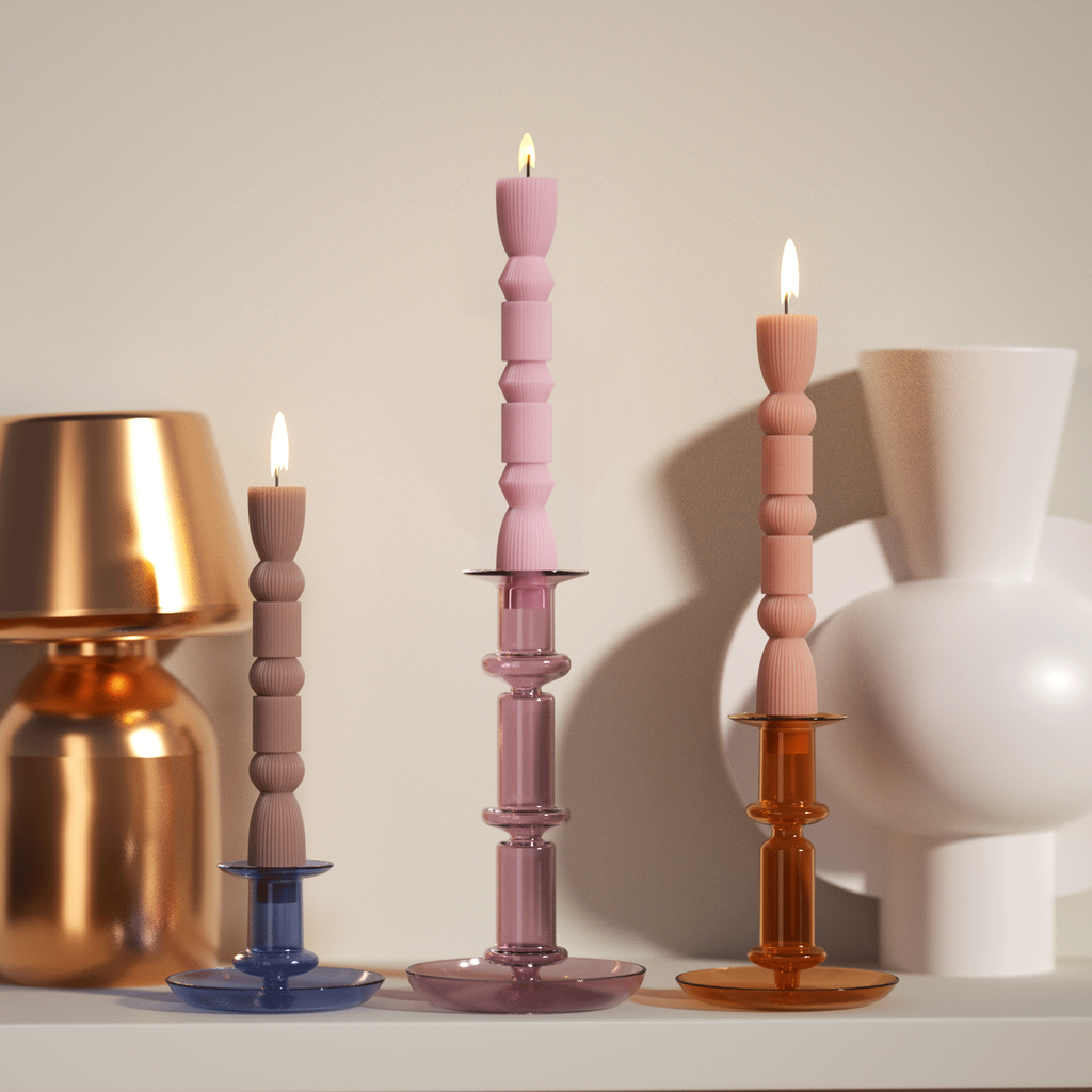 Three taper candles paired with candle holders for use in the bedroom -- Boowan Nicole