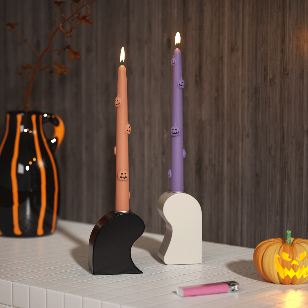 Light the pumpkin shaped taper candle indoors -Boowan Nicole