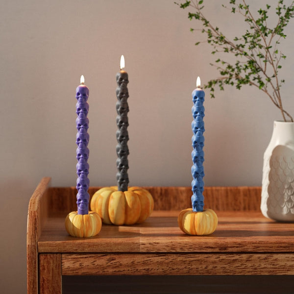 Black and blue skull taper candles with a pumpkin-shaped candle holder for a burning effect-Boowan Nicole