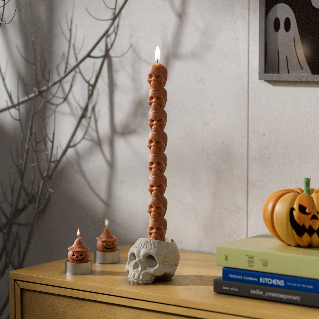 White skull taper candles lit on top of a skull-Boowan Nicole