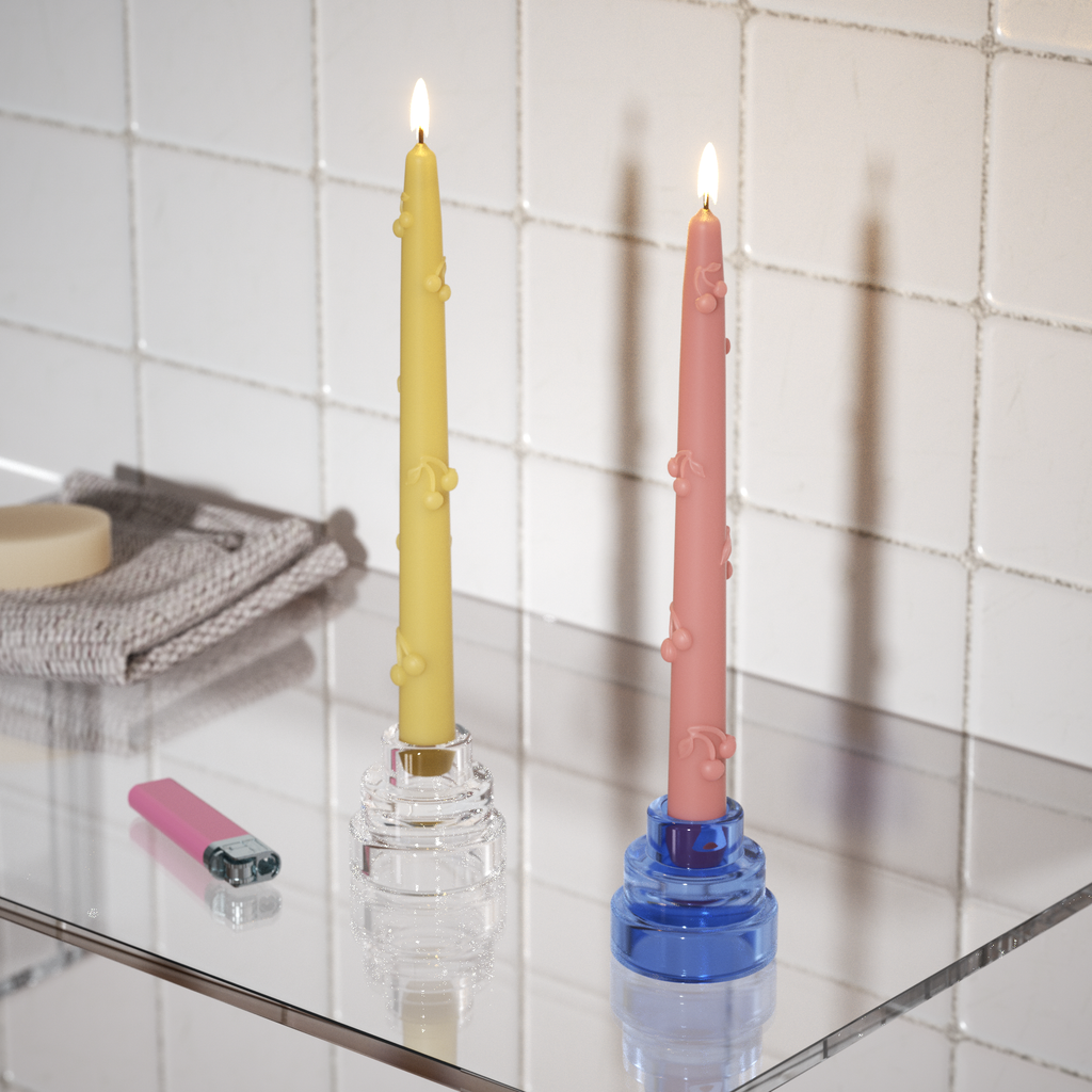 Cherry taper candle lit in the bathroom, filled with atmosphere and romance - Boowan Nicole.