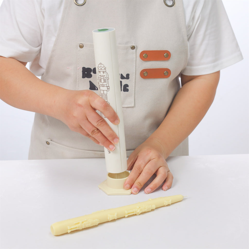 Use Boowan Nicole's candle stabilizer to secure the taper candle mold.