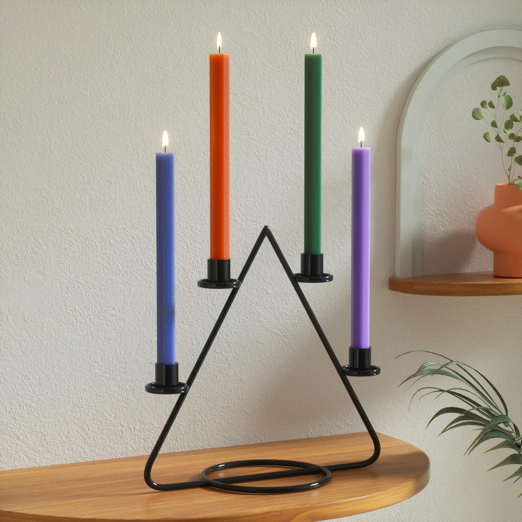 Colorful taper candles in a sleek black triangular holder, perfect for modern home decor and stylish candle displays-Boowan Nicole