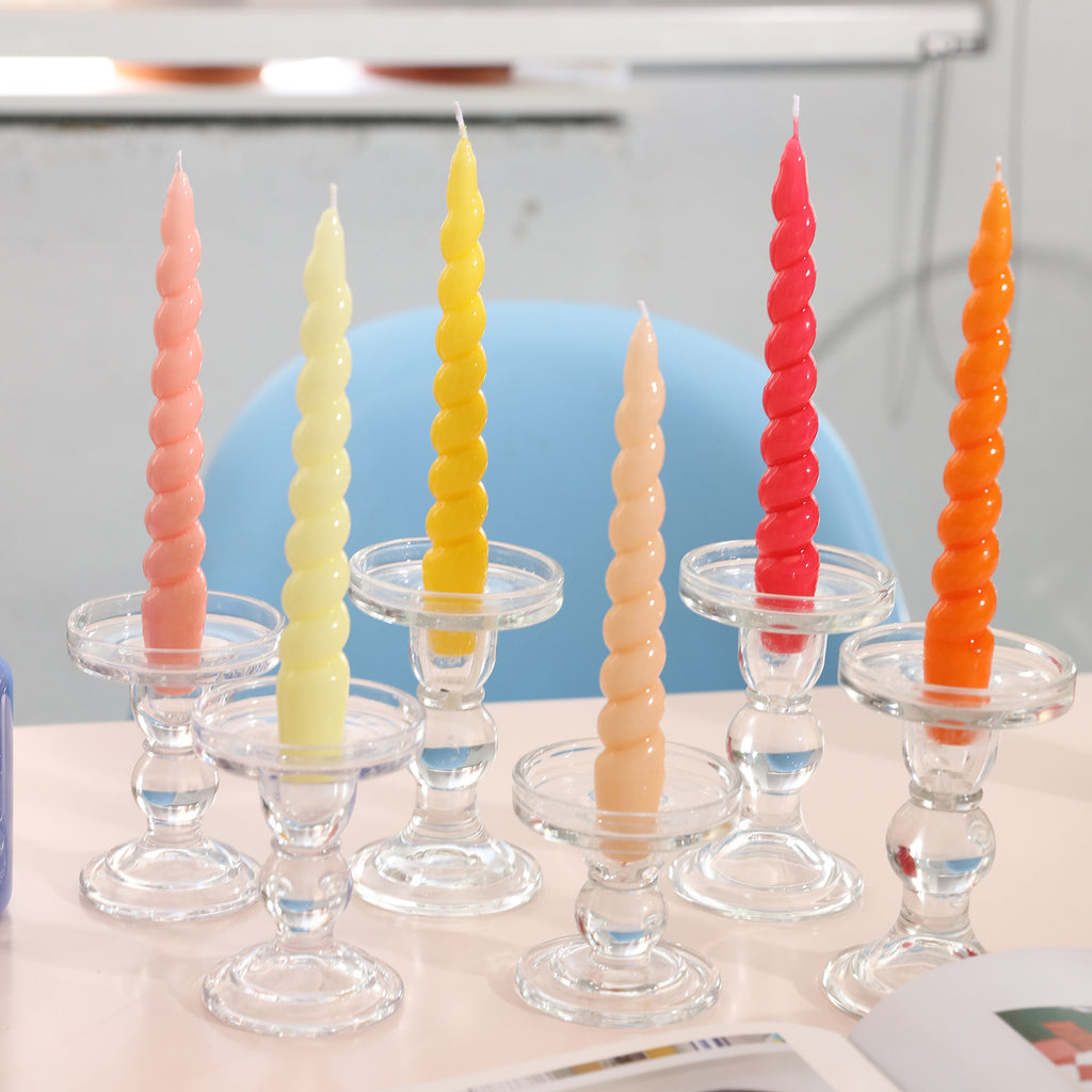 Six tapered spiral candles in gradient colors of pink, yellow and red placed on crystal candle holders-Boowan Nicole