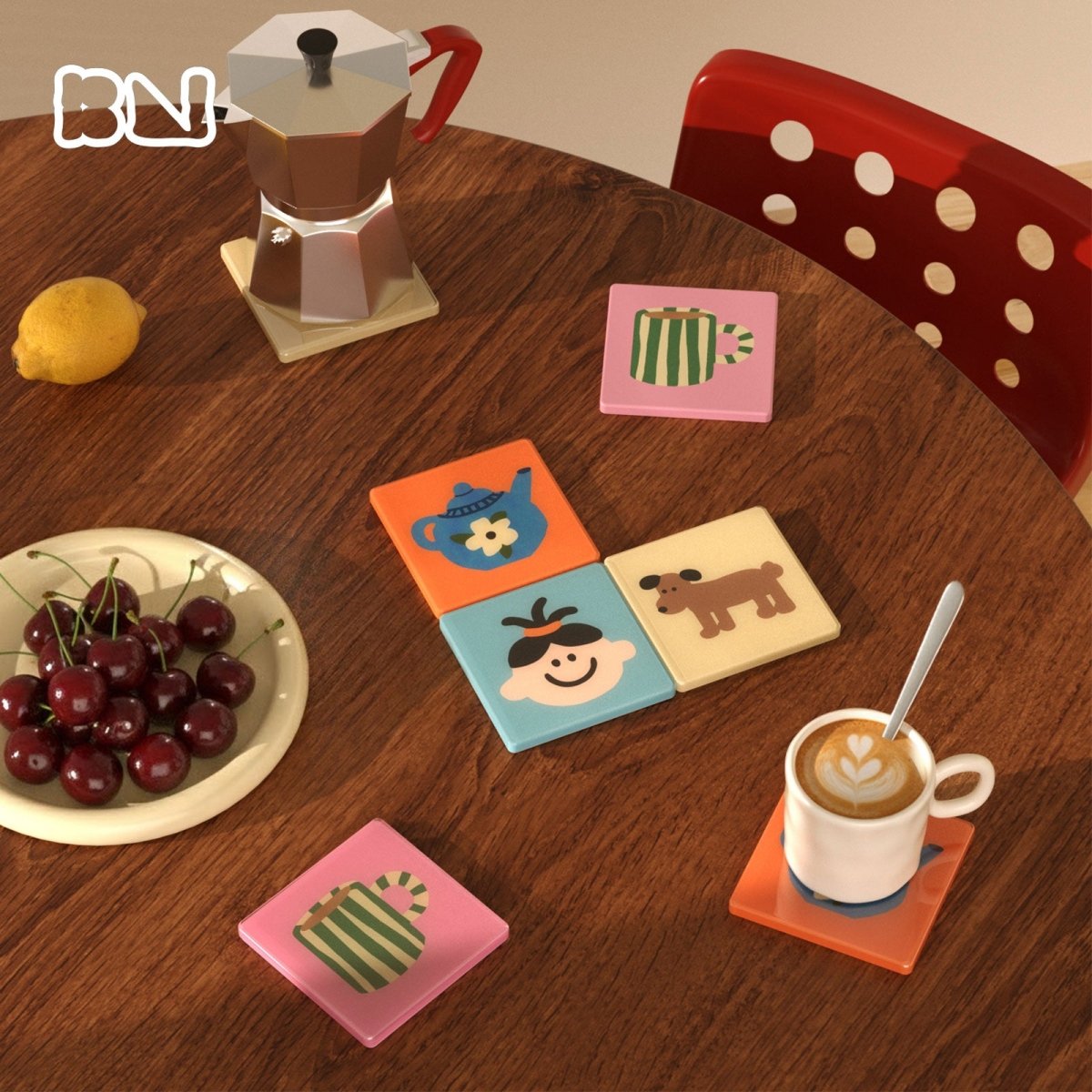 Colorful illustrated square drink coasters styled on a wooden coffee table with espresso, moka pot, cherries and a red chair - Boowan Nicole