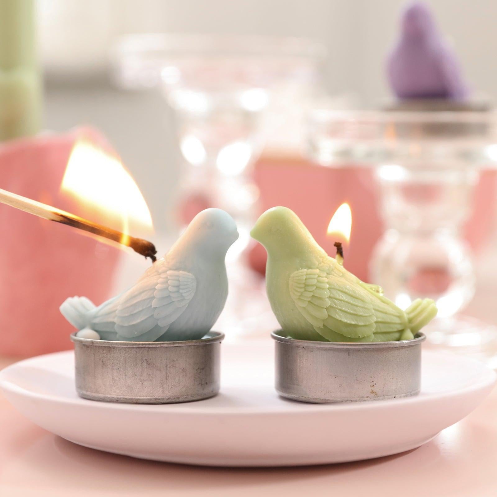 Light green and blue peace dove tea light candles, designed by Boowan Nicole.