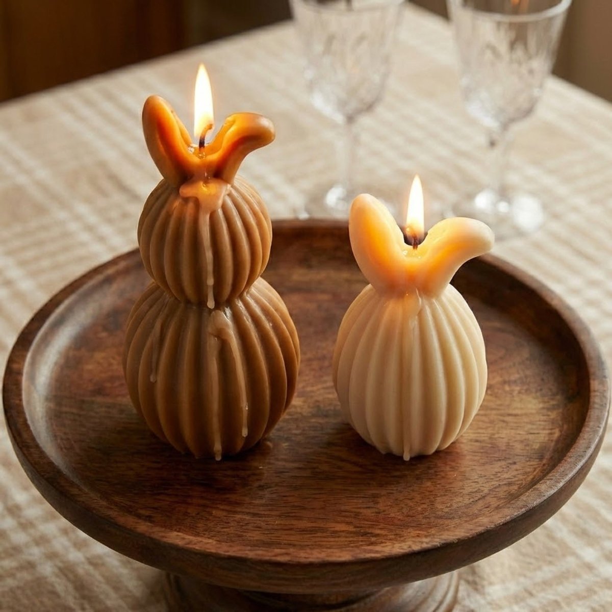 Lit ribbed bunny candles in brown and cream, featuring a two-tier and single-tier design for Easter home decor - Boowan Nicole