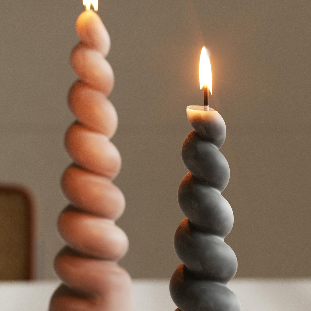 Lighting the twisted pillar candle adds a cozy and atmospheric touch to the space - Boowan Nicole