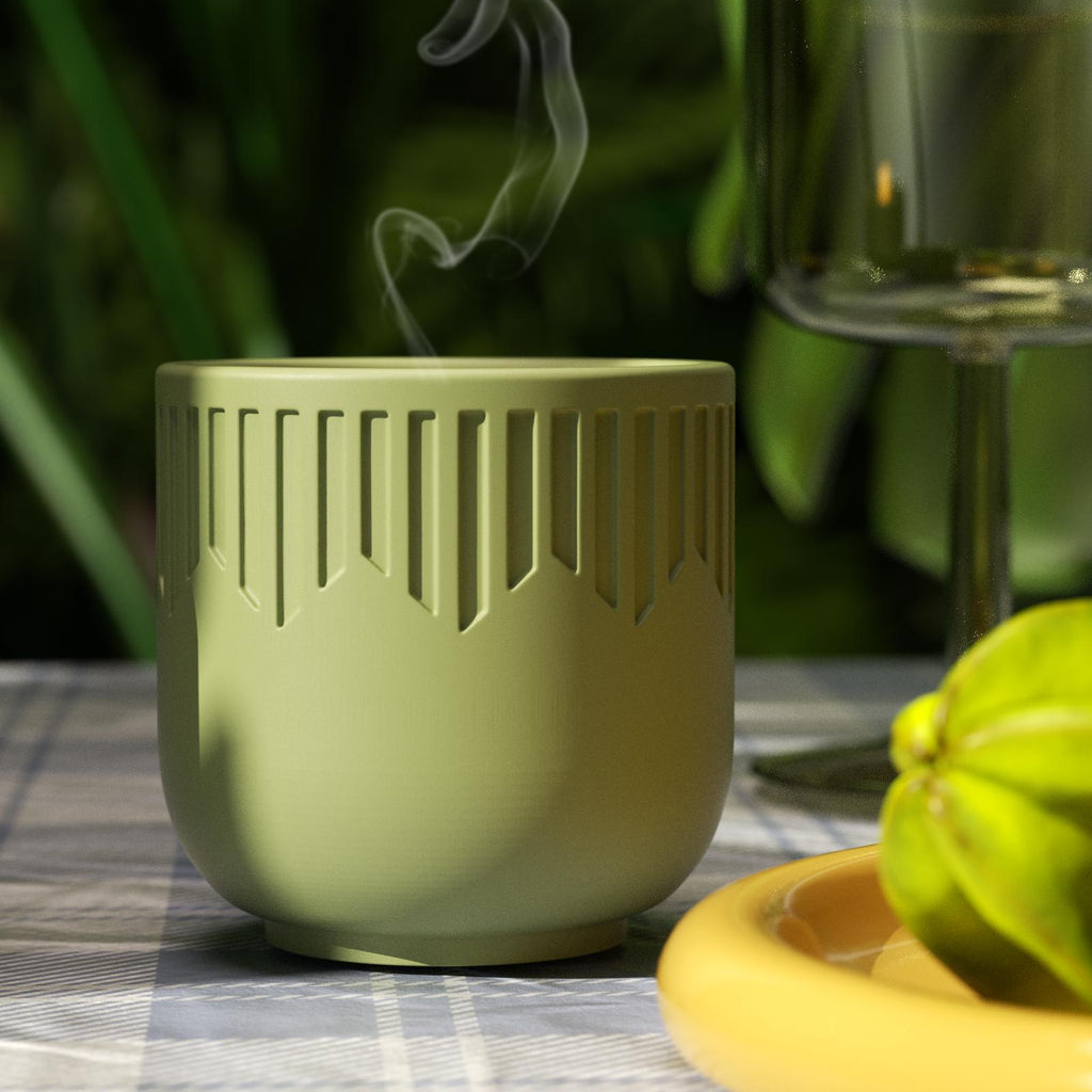 Green geometric candle jar with smoke trail on outdoor table with fruit and glassware - Boowan Nicole