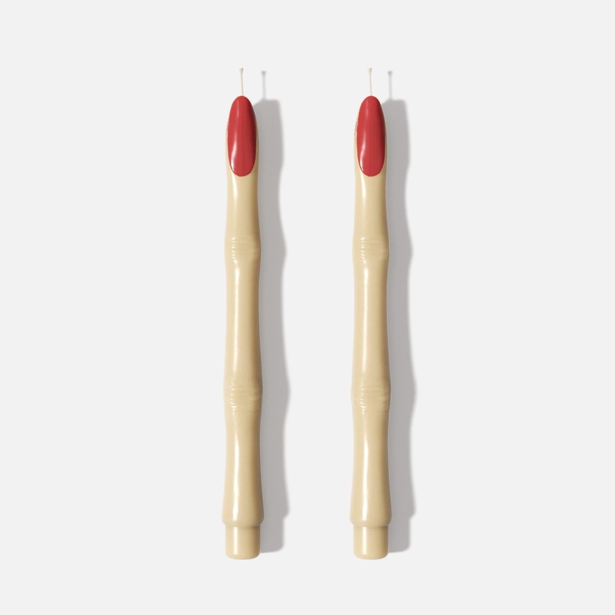 Two tapered candles shaped like witch’s fingers with red nail tips - Boowan Nicole