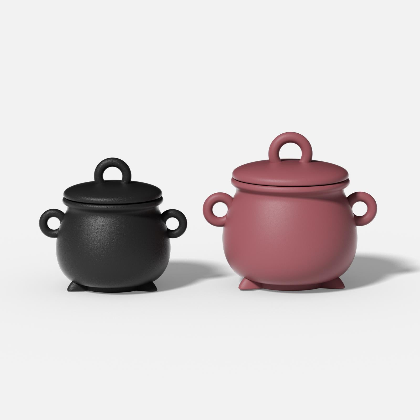 Two witch’s cauldron-shaped candle jars in black and burgundy with three side handles and matching lids - Boowan Nicole